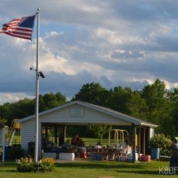 America Flag flying over a park pavilion