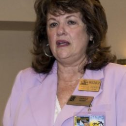 woman speaking at a ceremony