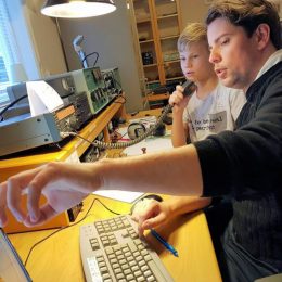 two young ham radio operators at a station