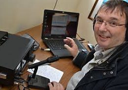 ham radio operator at desktop station