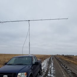 a dipole antenna mounted to the back of a truck