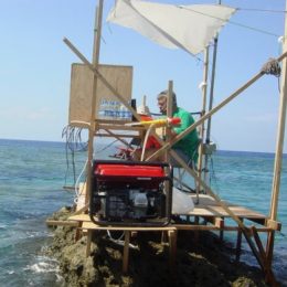 ham radio operator in a tiny station on Scarborough Reef