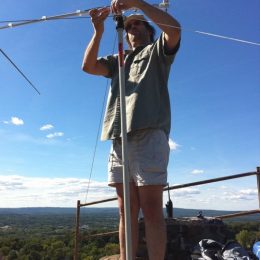 man building a small portable radio antenna