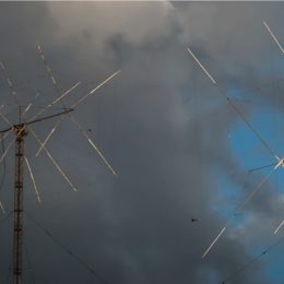 ham radio antennas near dark storm clouds