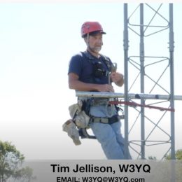 man climbing a ham radio tower