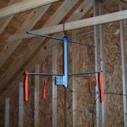 ham radio antenna being hung in attic