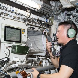astronaut making a ham radio contact from space station