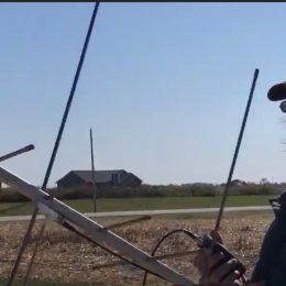 man holding a large ham radio antenna