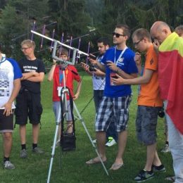 group of ham radio operators at outdoor antenna