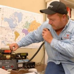 man using a ham radio station