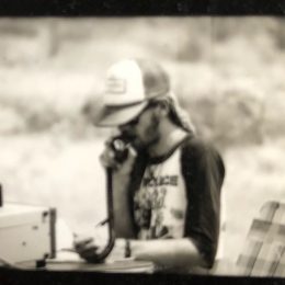 vintage photo of a man at an outdoor ham radio station