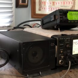 ham radios next to dx engineering coffee mug