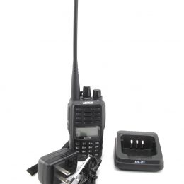An Alinco handheld ham radio and charger