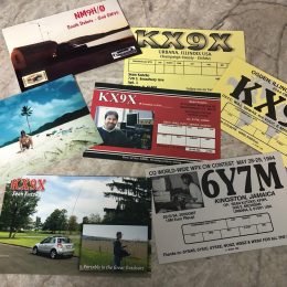 collection of ham radio qsl cards on a table