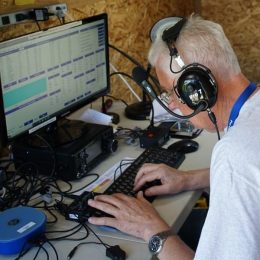ham radio operator working at a field day station