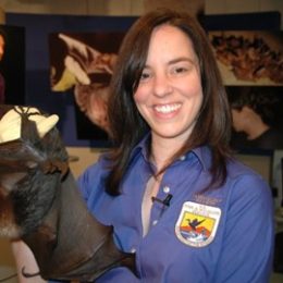 zoologist holding a bat