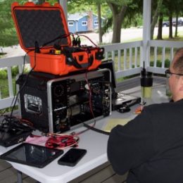 man working at a ham radio portable field day station