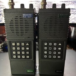 a pair of vintage ham radio handy talkies