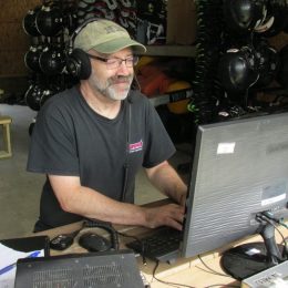 Man operating a field day ham radio station outside