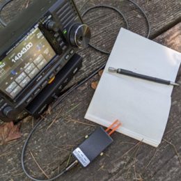 Icom IC-705 set up on a picnic table