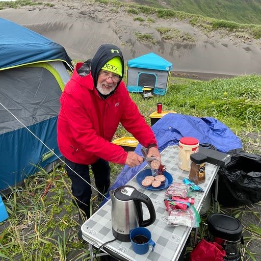 Photo of Hal, W8HC, preparing a meal