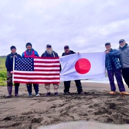 Kiska Island K7K DXpedition team holding flags