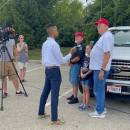 reporter interviewing ham radio operators during field day