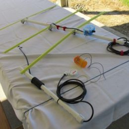 ham radio antenna being built on a table outside
