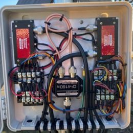 dx engineering utility enclosure filled with cable and junction bus blocks