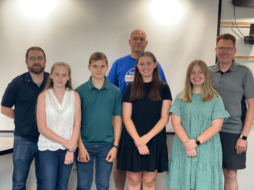 a group of young and old ham radio operators