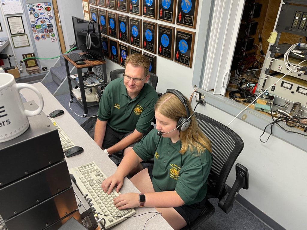 a pair of ham radio operators using an amateur radio station