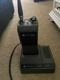 vintage motorola ham radio on charging stand