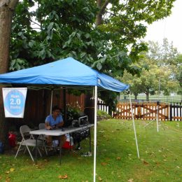 ham radio operator at a station under a tent