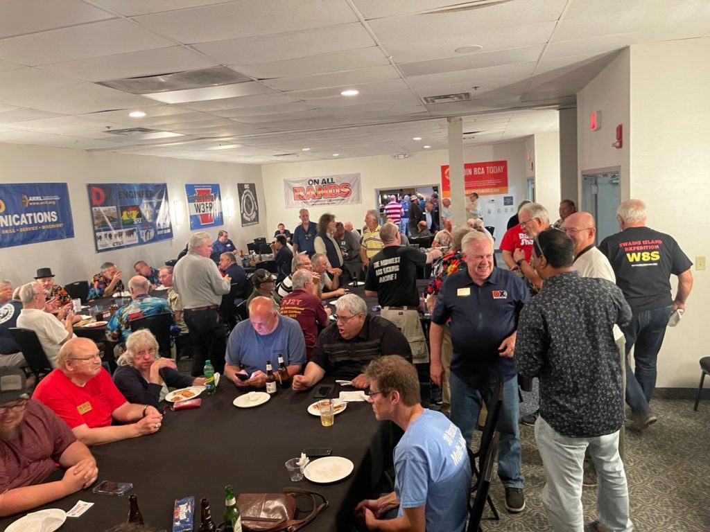 crowd mingling in a small room
