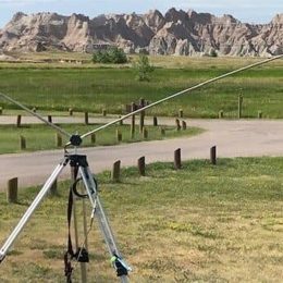 dipole antenna on grassland near mountains