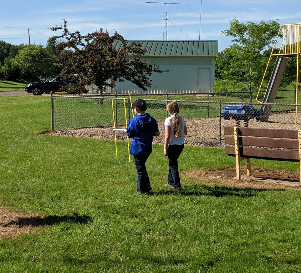 a pair of kids near ham radio antennas