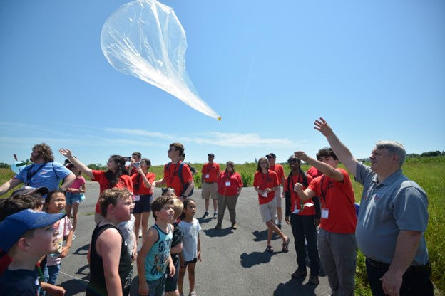 A group of kids launching a weather balloon
