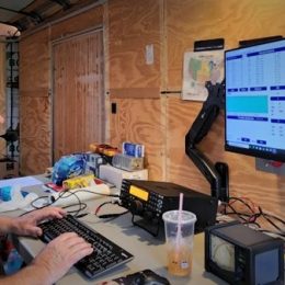Ham operating a field day ham radio station