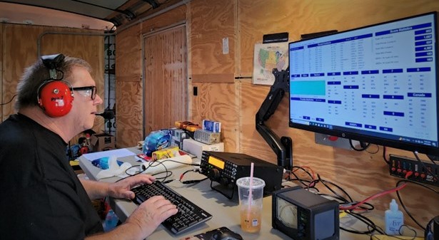 Ham operating a field day ham radio station