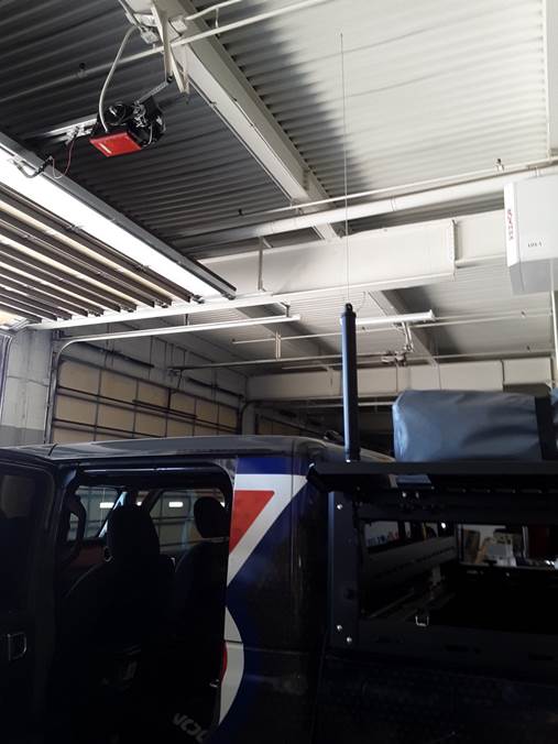 Large HF Radio antenna base on a jeep rack