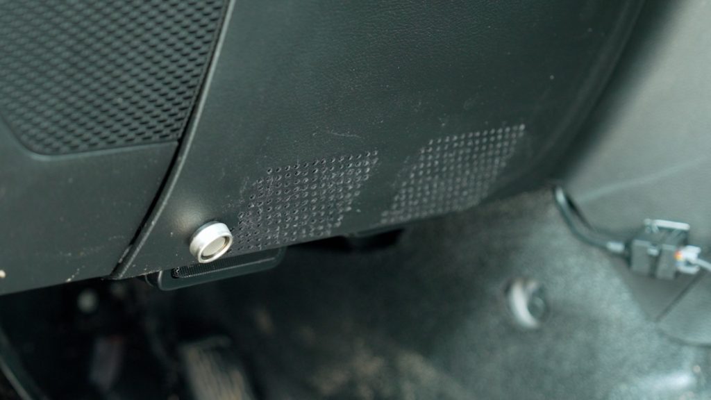 Perforated Panel under a car steering wheel