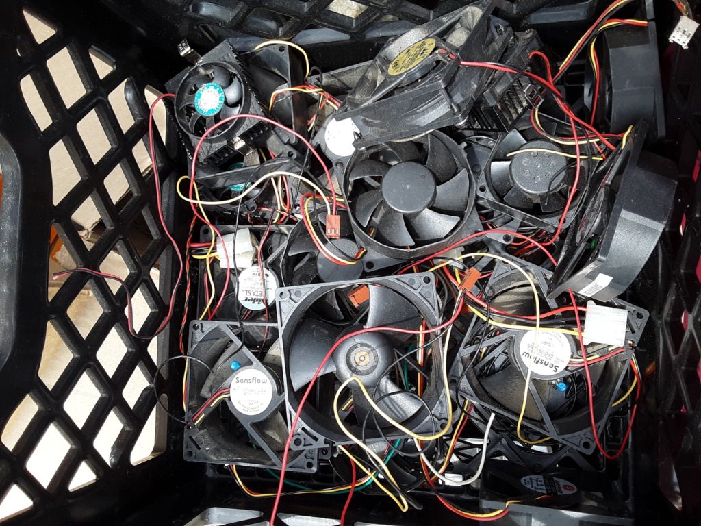 computer cooling fans in a milk crate