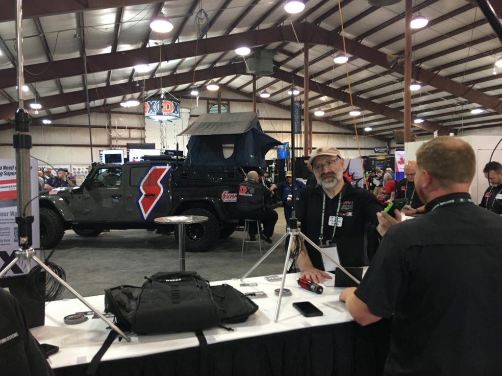 men talking at ham radio antenna booth at hamvention