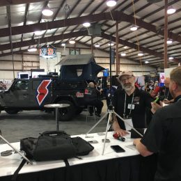 men talking at ham radio antenna booth at hamvention