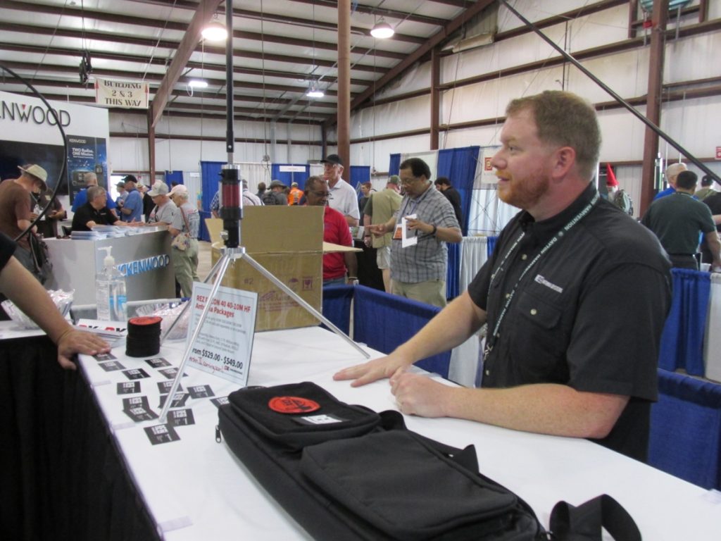 man speaking behind table at Hamvention