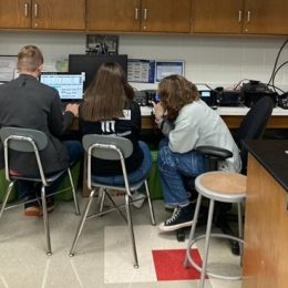 close up of students using a ham radio station