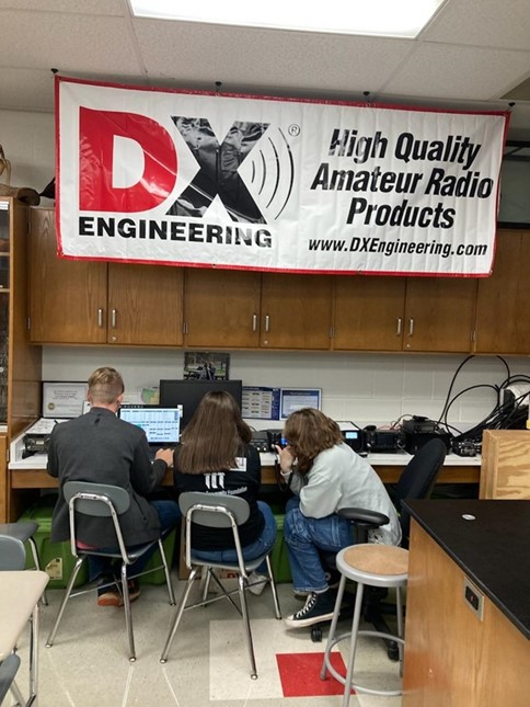 young students using a ham radio in school