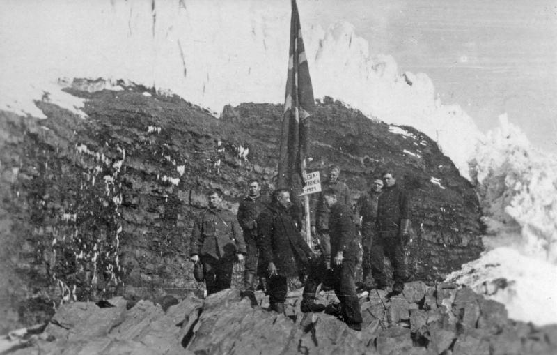 historical photo of men landing on Peter I Island, Antarctica