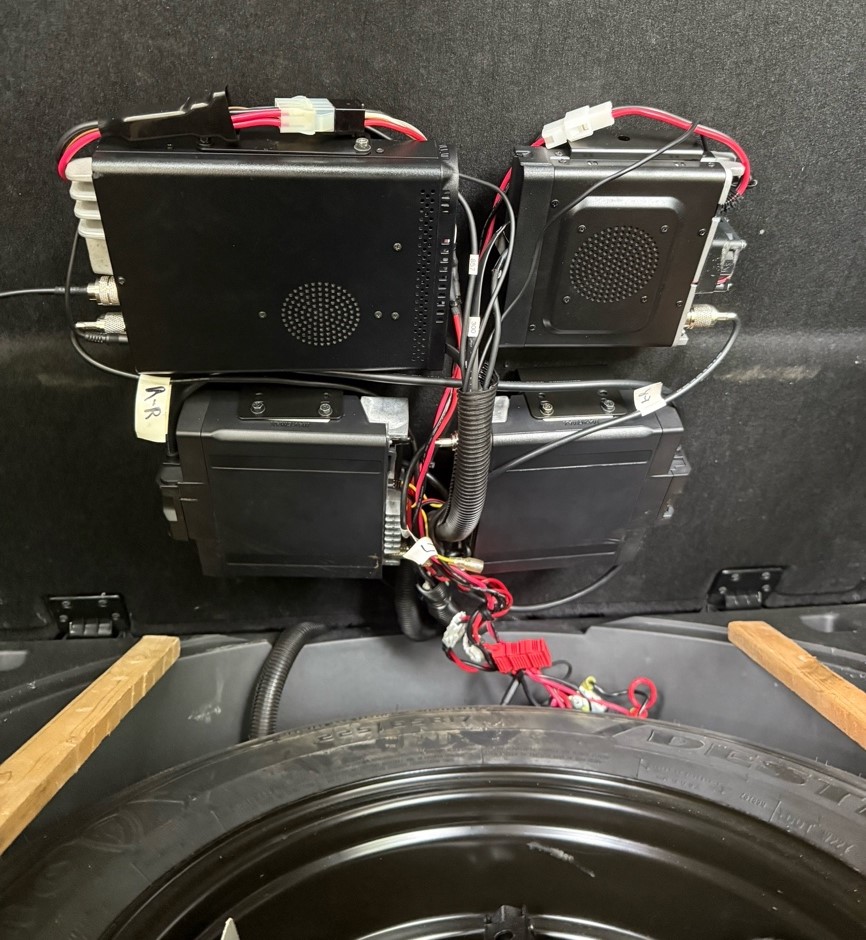ham radios installed behind a car seat
