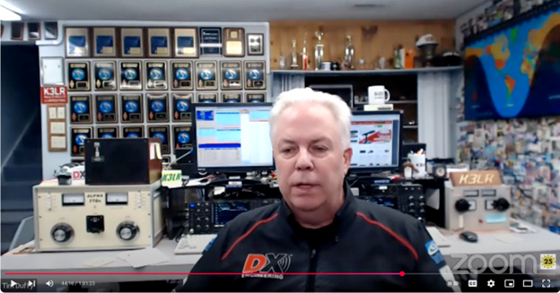 screenshot of a man being interviewed on screen in virtual meeting